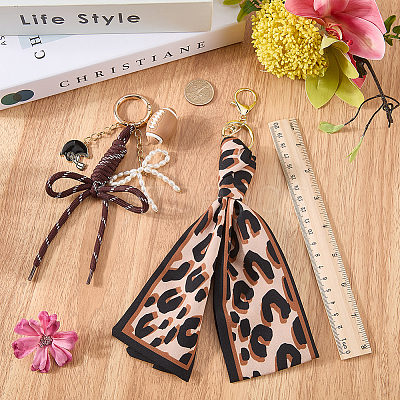 2Pcs 2 Styles Silk Leopard Print Scarf & Nylon Cord & PVC Rugby Pendant & Alloy Enamel Baseball Helmet Pendant & Glass Pearl Bowknot Keychain HJEW-ME00159-1